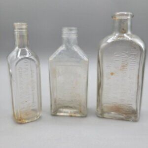 Antique Glass Bottles Clear Embossed Set of 3
